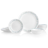 Corelle Country Cottage white dinnerware service with plates, bowls, and mugs arranged on a table.