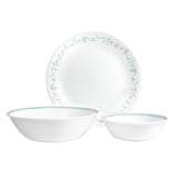 Corelle Country Cottage white dinnerware service with plates, bowls, and cups arranged on a table.