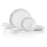 Corelle Country Cottage white dinnerware service set with plates and bowls arranged on a table.