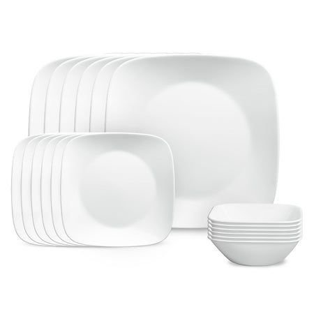 Corelle pure white dinner service with plates and bowls arranged on a table, showcasing sleek white ceramic tableware.