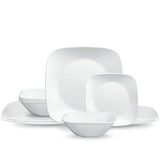 Corelle PURE WHITE dinner service featuring white ceramic plates and bowls arranged on a clean, minimalist table setting.