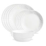 Corelle Bella Faenza white dinnerware service with plates and bowls arranged on a table, showcasing elegant ceramic tableware.