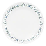 Corelle Country Cottage white dinnerware set with floral graphic design, includes plates and bowls arranged on a table.