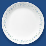 Corelle Country Cottage white ceramic dinnerware set with floral graphic design, includes plates and bowls.