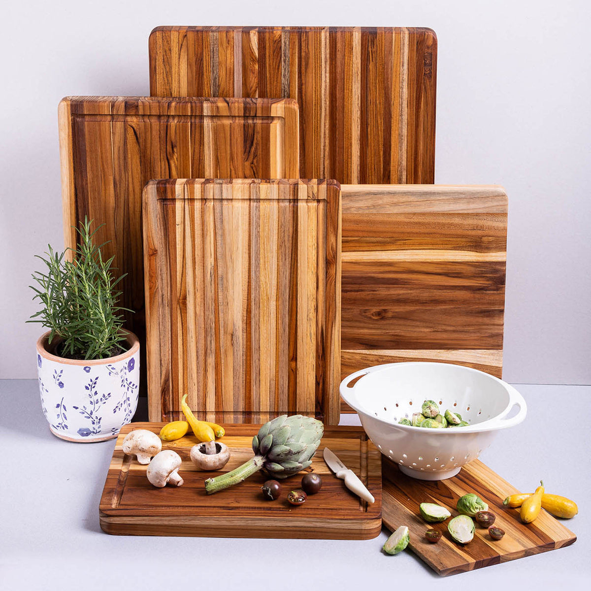 Teakhaus teak wood rectangular cutting board with traditional design, showing smooth surface and sturdy construction.