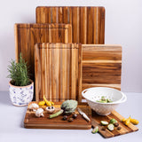 Teakhaus teak wood rectangular cutting board with traditional design, showing smooth surface and sturdy construction.