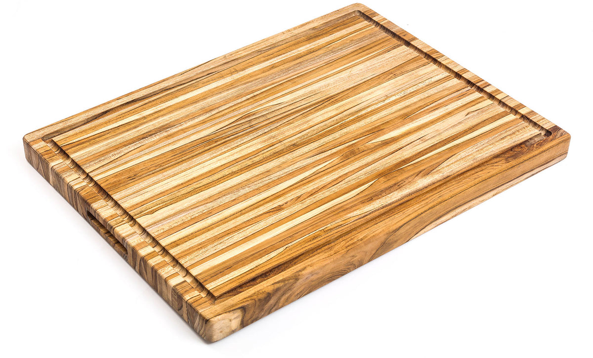 Teakhaus teak wood cutting board, rectangular shape, traditional design, natural wood grain, used for chopping and food prep.