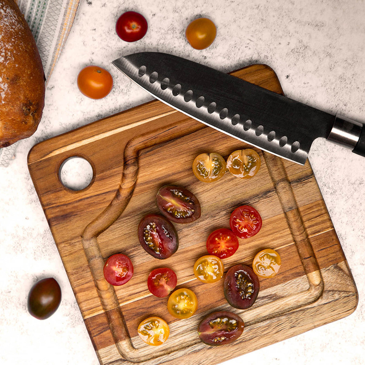 Teakhaus Marine teak wood cutting board with smooth surface and natural wood grain for kitchen use.