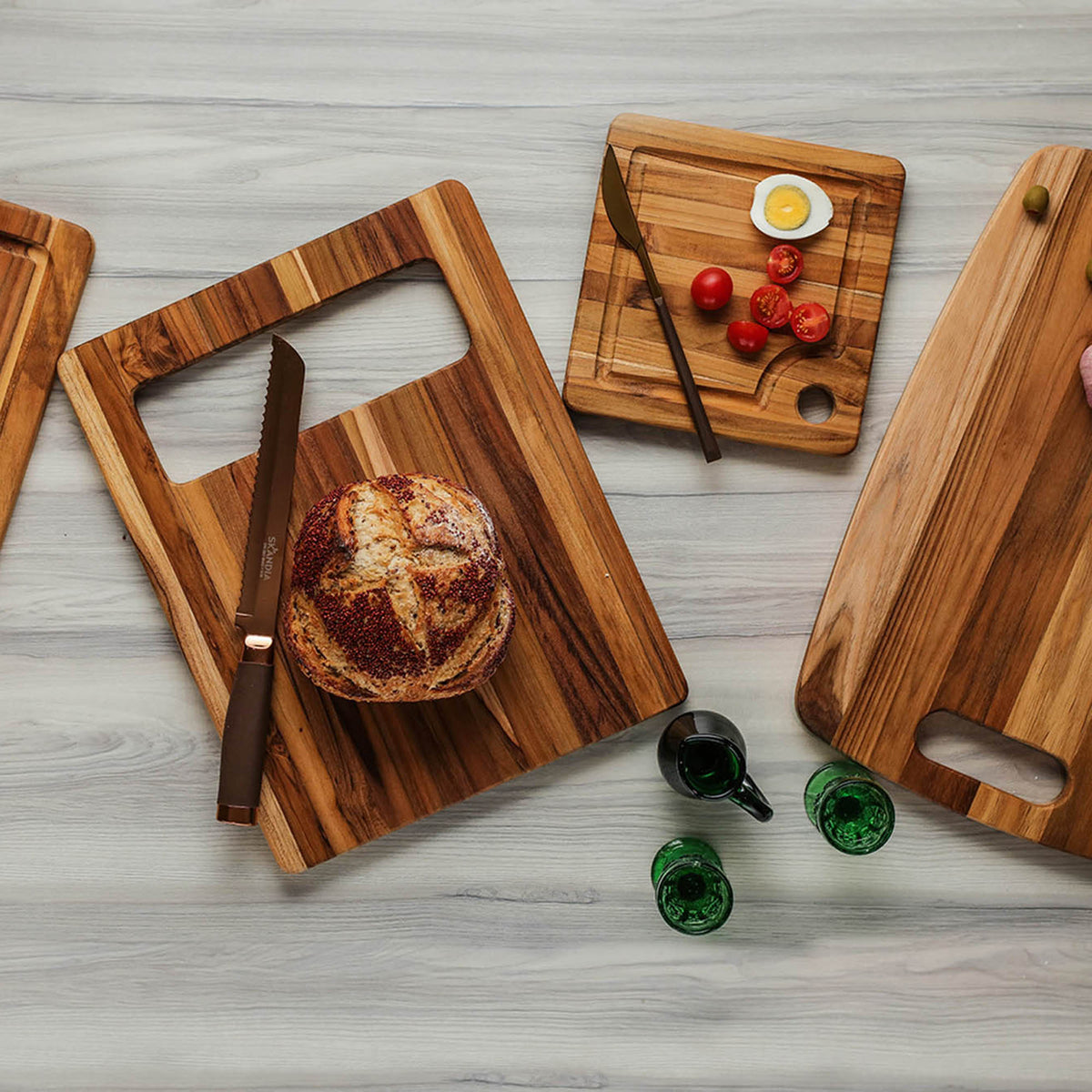 Teakhauss Marine teak wood cutting board with smooth surface and natural grain, ideal for kitchen use and food preparation.