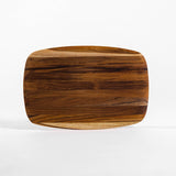 Teakhaus rectangular teak wood cutting board with elegant finish, ideal for food prep and serving on kitchen countertop.