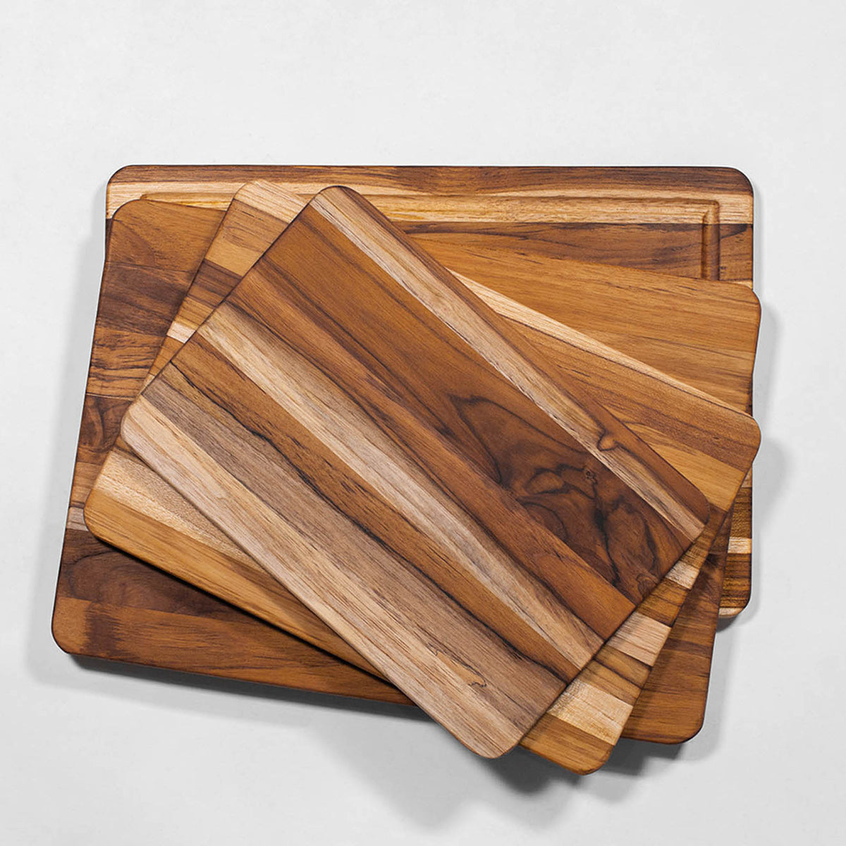 Teakhaus teak wood cutting board, ESSENTIAL series, natural finish, rectangular shape with smooth edges, ideal for kitchen prep.