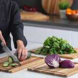 Teakhaus Essential teak wood cutting board with smooth surface, natural grain, and sturdy construction for kitchen use.