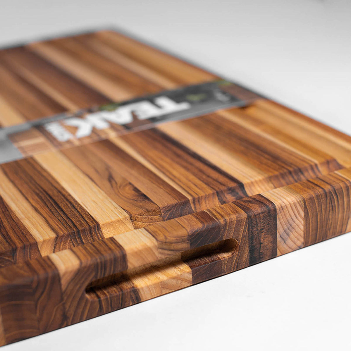 TEAKHAUS teak wood cutting board, rectangular shape, traditional design, durable and natural wood surface for kitchen use.