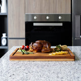 TEAKHAUS teakwood rectangular cutting board with traditional finish, ideal for kitchen prep and serving.