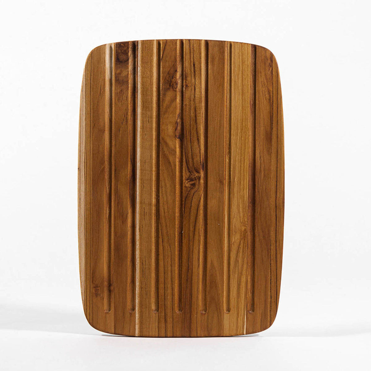 Teakhaus teak wood cutting board, ESSENTIAL series, natural teak finish with smooth surface for kitchen food prep.
