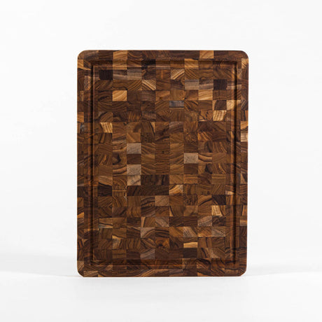 TEAKHAUS teak wood butcher block cutting and chopping board with smooth surface and sturdy construction for kitchen use.