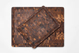 Teakhaus teak wood butcher block cutting board with smooth surface and sturdy construction for kitchen use.