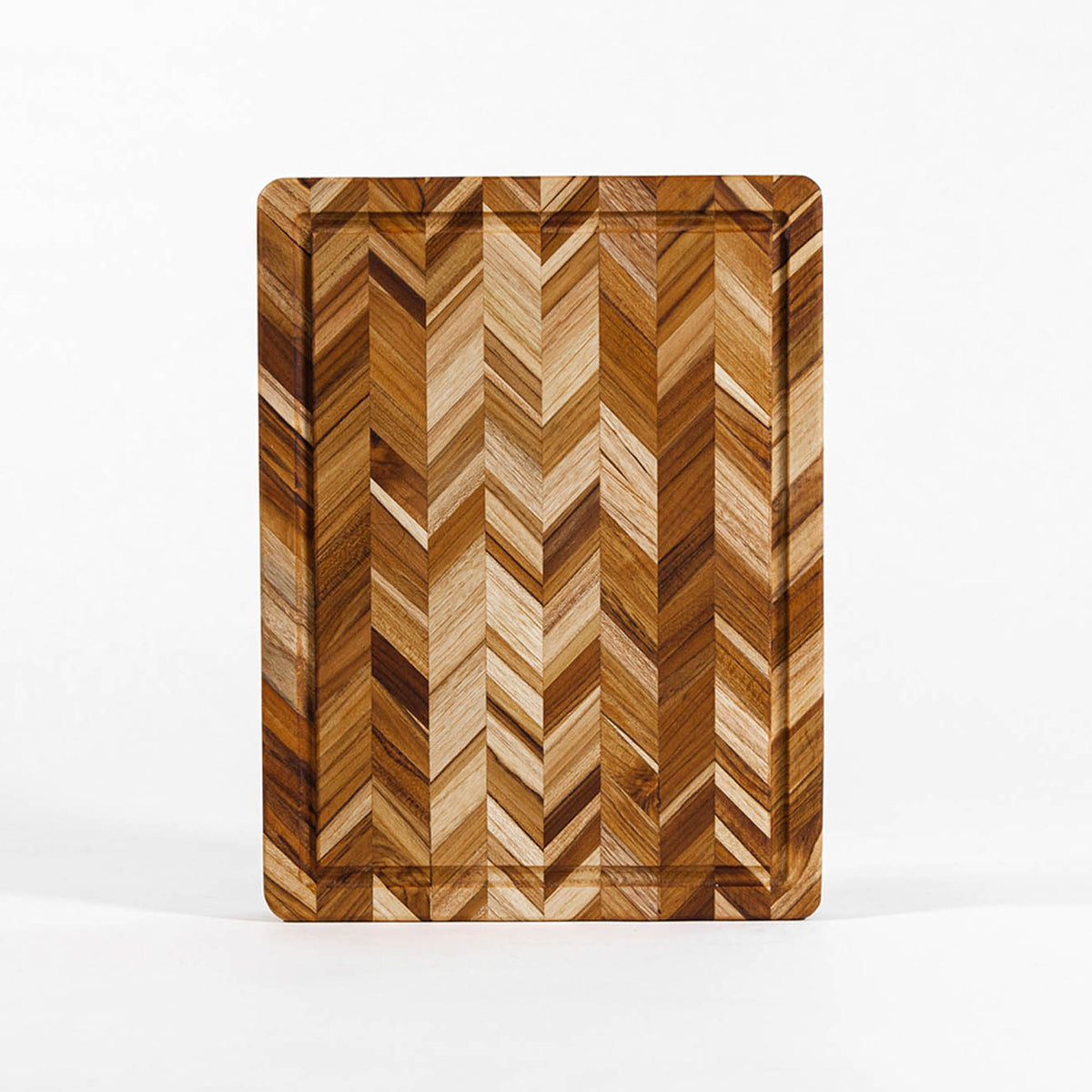 TEAKHAUS teak wood cutting board with herringbone pattern, ideal for kitchen prep and serving, made from durable teak wood.