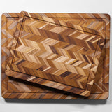 TEAKHAUS teak wood cutting board with herringbone pattern, ideal for preparing tea and kitchen tasks.