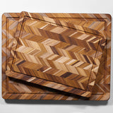 TEAKHAUS teak wood cutting board with herringbone pattern, ideal for kitchen prep and serving, made from durable teak wood.