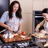 Teakhaus teak wood cutting board with herringbone pattern, ideal for kitchen food preparation and serving.