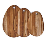 Oval teak cutting board by TEAKHAUS made of durable teak wood, ideal for food preparation and serving.