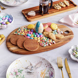 TEAKHAUS teakwood oval cutting board, natural finish, sturdy rectangular design, ideal for kitchen food preparation.