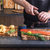 Teakhaus teak wood cutting board with herringbone pattern, ideal for kitchen prep and serving.
