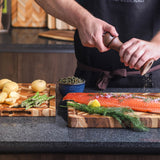Teakhaus teak wood cutting board with herringbone pattern, ideal for kitchen prep and serving.