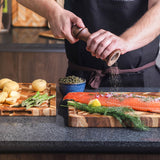 Teakhaus teak wood cutting board with herringbone pattern for kitchen prep and serving.
