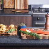TEAKHAUS teak wood cutting board with herringbone pattern, ideal for kitchen prep and serving.