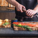 TeakHAUS teak wood cutting board with herringbone pattern, ideal for kitchen prep and serving, made from durable teak wood.