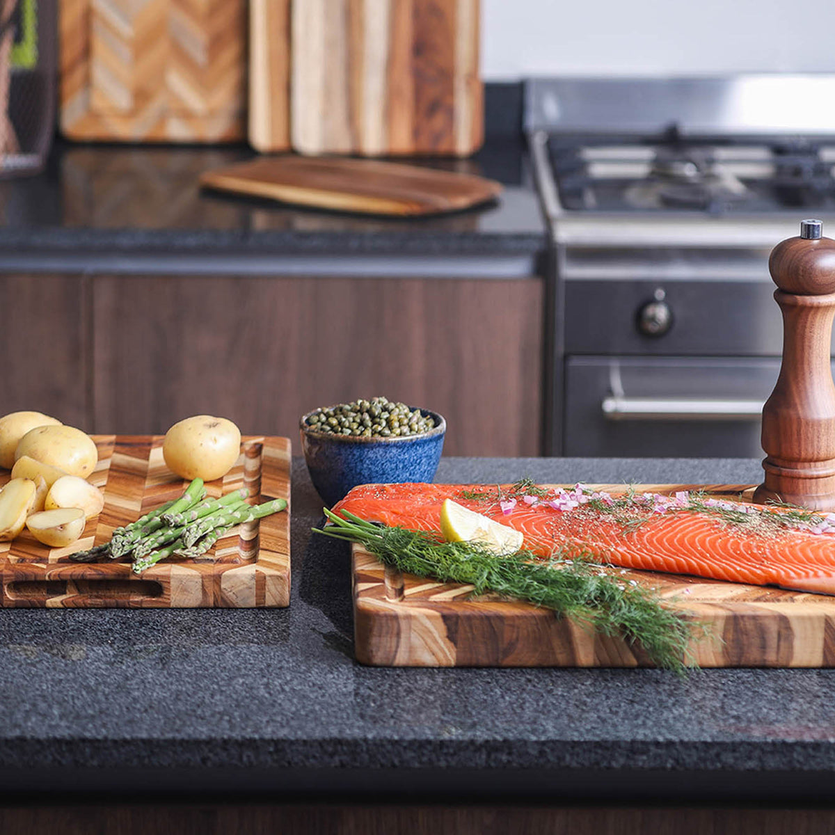 Teakhauss rectangular teak wood cutting board with herringbone pattern for kitchen use.
