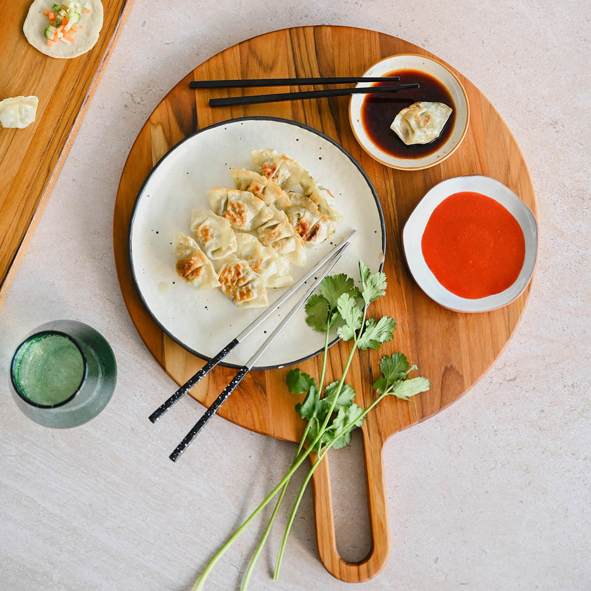 TEAKHAUS teak wood cutting board with a smooth surface, rectangular shape, and natural wood grain detail.