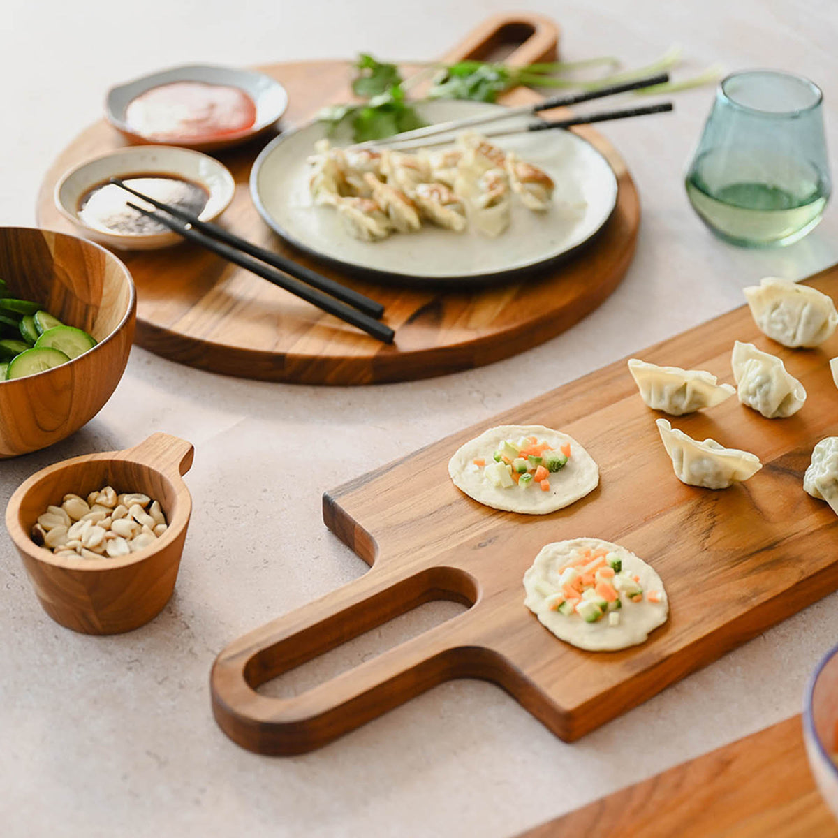 Teakhaus teak wood cutting board with bistro design, natural finish perfect for food prep and serving.