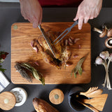 BÉRARD MILLINARI olive wood cutting board with smooth surface and natural brown finish for kitchen prep and serving.