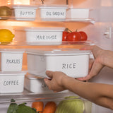 White HONEYWARE enameled vacuum container with 740 ML capacity, featuring a sleek design and secure lid for food storage.