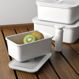 HONEYWARE white enamelled vacuum storage canister with a 1.12L capacity, featuring a secure lid and smooth finish.