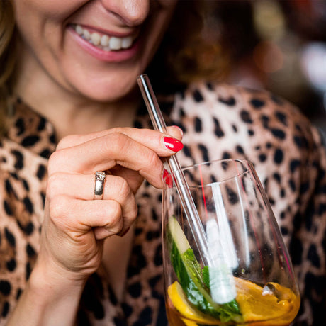 Clear glass drinking straw by PROFINO, showing a smooth, transparent straw suitable for beverages.