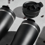 Black PROFINO BARISTA thermobecher with stainless steel body and lid, designed for hot beverages and daily use.