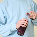 PROFINO Sparkle 600 ml stainless steel water bottle with a clear lid and vibrant design, ideal for staying hydrated on the go.