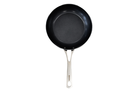 Kyocera ceramic frying pan in black with a smooth non-stick surface, ideal for versatile cooking.