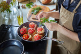Kyocera ceramic frying pan in black with non-stick surface, ideal for healthy cooking and easy cleaning.