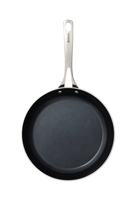 Kyocera ceramic frying pan in black with a smooth non-stick surface, ideal for versatile cooking.