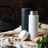 KYOCERA Slim Mug insulated bottle in white with a sleek, modern design, perfect for hot or cold beverages.