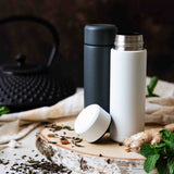 KYOCERA slim gray insulated bottle, Isolierflasche, with a sleek design and screw-top lid, ideal for hot or cold drinks