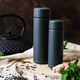 KYOCERA Slim Mug insulated bottle in gray with a sleek, compact design for hot or cold beverages.