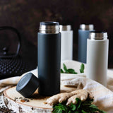 Gray KYOCERA Slim Mug insulated bottle with a sleek design, perfect for hot and cold beverages.