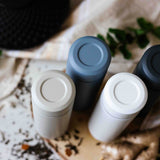 Blue KYOCERA Slim Mug insulated bottle with sleek design, stainless steel body, and secure lid for hot and cold beverages.