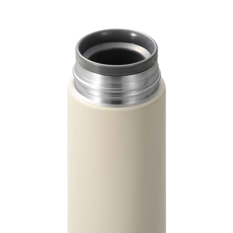 KYOCERA Slim Mug insulated bottle in beige, 300ml, showcasing the sleek design and durable construction of the beverage container.